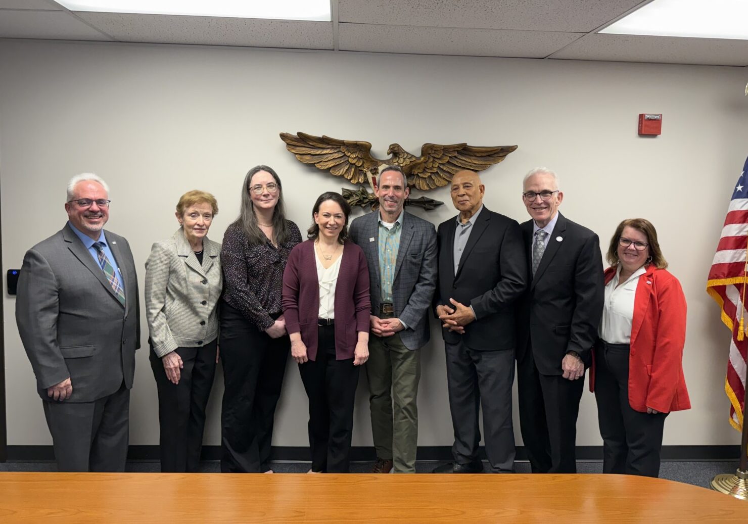 MHA, Community Hope, and NewBridge Services leadership posing with Assemblywoman Aura Dunn