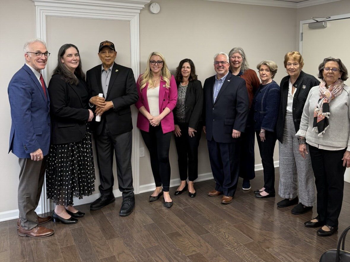 Group photo of Assemblywoman Sweeney with MHA and community partners